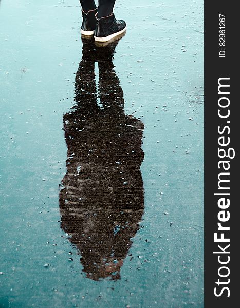 Shadow of Person on Water during Daytime