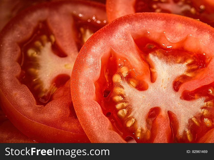 Closeup of slices of fresh red tomatoes.