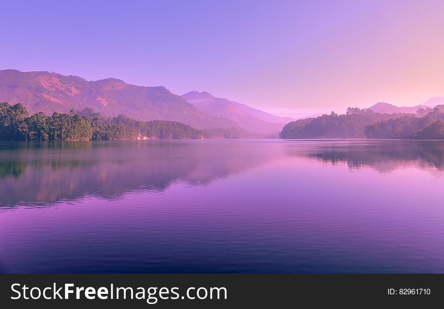 Purple skies at sunset reflecting in alpine lake. Purple skies at sunset reflecting in alpine lake.