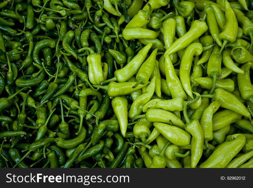 Green textured background created by Anaheim (mild) and Serrano (hot) peppers,. Green textured background created by Anaheim (mild) and Serrano (hot) peppers,
