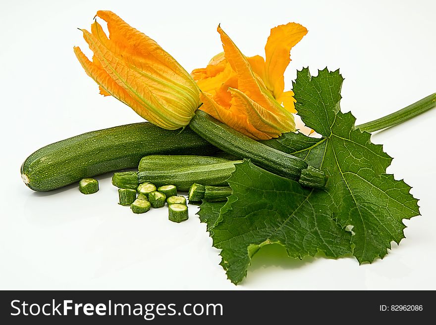 Green Elongated Vegetable With Yellow Flower