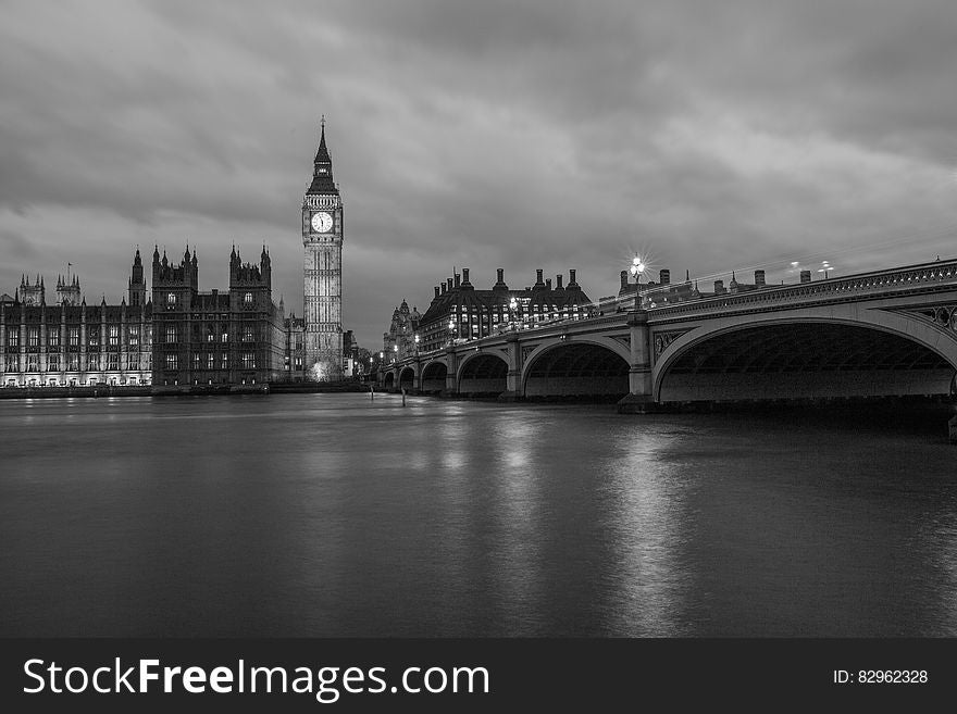 A black and white view of river Thames in London with the Westminster bridge and Westminster palace. A black and white view of river Thames in London with the Westminster bridge and Westminster palace.
