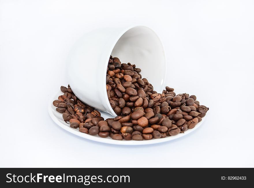 Coffee Beans on White Ceramic Saucer
