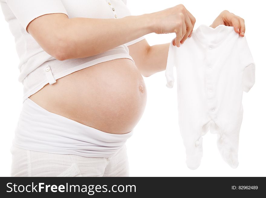 Pregnant Woman in White T Shirt and Shorts