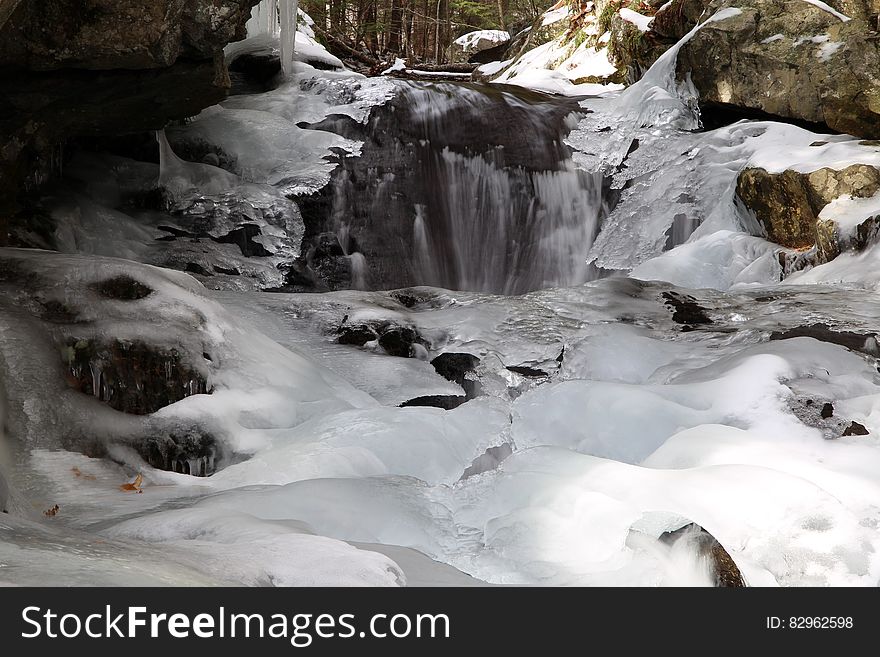 Frozen rocky stream and waterfall. Frozen rocky stream and waterfall.