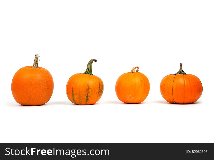 Miniature pumpkins isolated on white.
