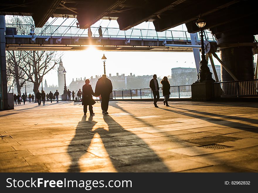 Couples Walking Along South Bank, London