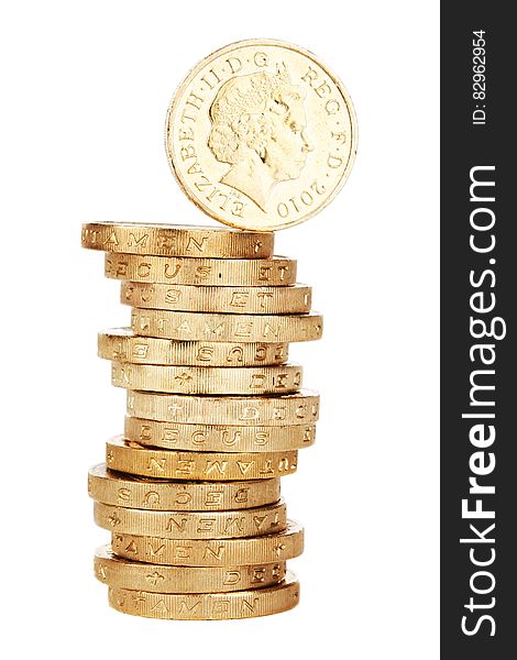 Tall stack of British one pound coins viewed from side with one balancing on top, white background.