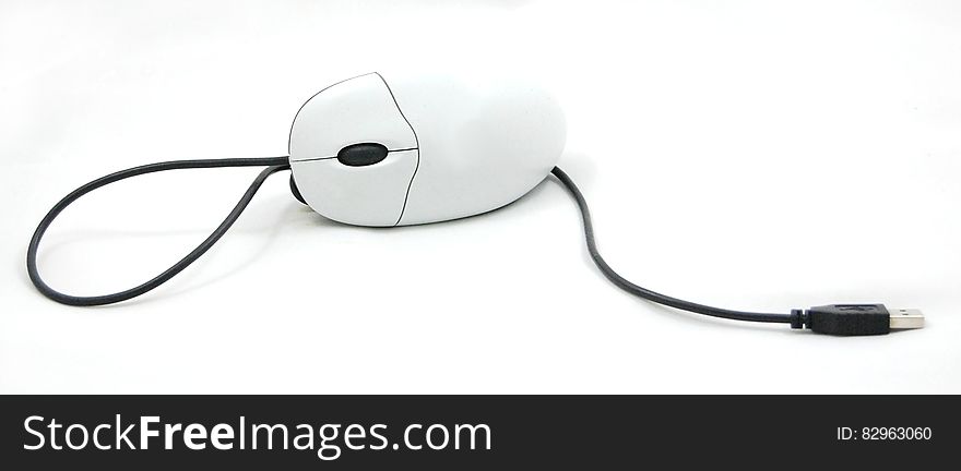 Isolated white computer mouse with cable. Isolated white computer mouse with cable.