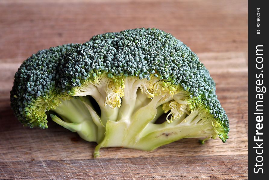 Green Broccoli Vegetable on Brown Wooden Table