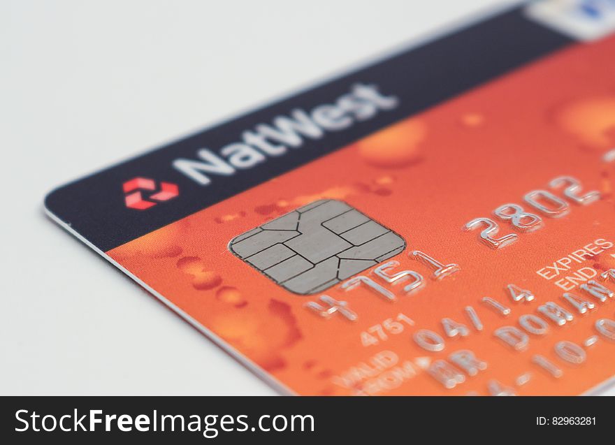 Close up of a NatWest orange and black credit card with microchip. Close up of a NatWest orange and black credit card with microchip.