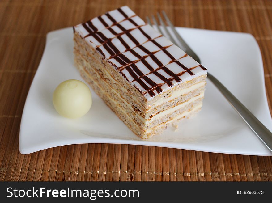 White And Beige Dessert Served On White Ceramic Square Plate