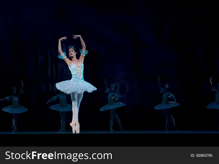 Woman in Blue Ballerina Dress Performing Dance