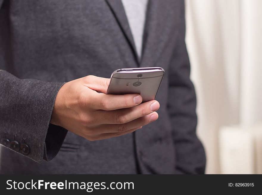 Person Holding Grey Smartphone