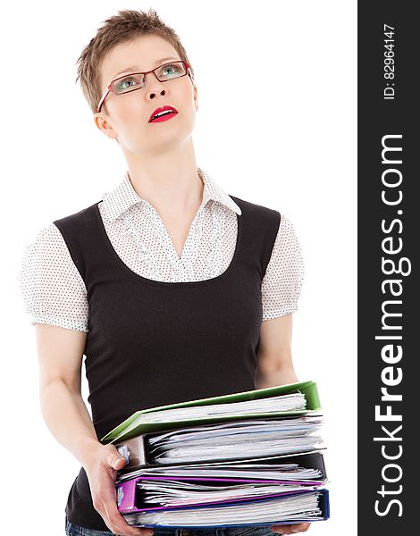 A woman with lot of folders filled with paperwork. A woman with lot of folders filled with paperwork.