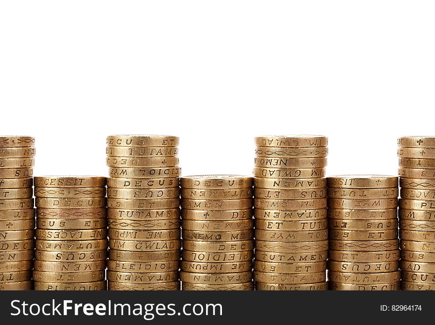 Pile of gold coins isolated on white with copy space.