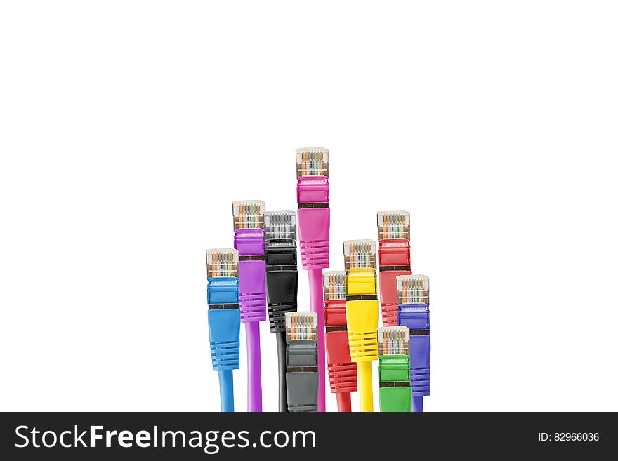 Colorful cables with network plastic plugs isolated on white with copy space. Colorful cables with network plastic plugs isolated on white with copy space.