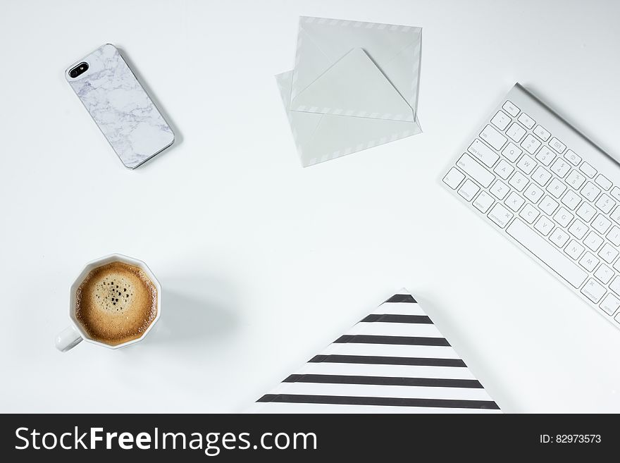 Apple Magic Keyboard Besides White Letter Envelope