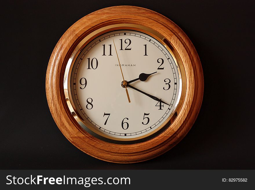 Brown Wooden Framed Clock Showing 2:19