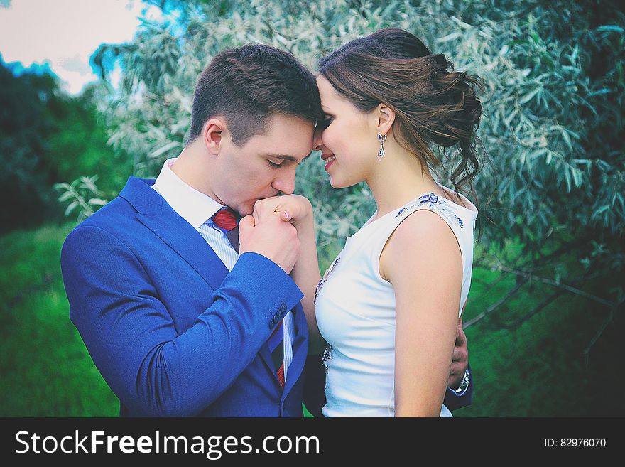 Man Kissing Woman&#x27;s Right Hand