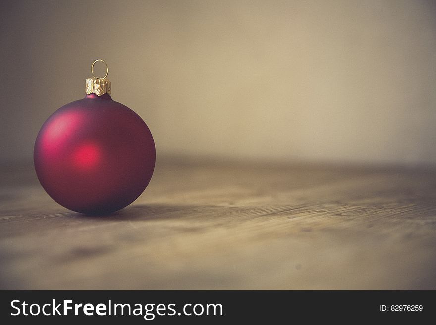 Red Christmas Bauble In Selective Focus Photography