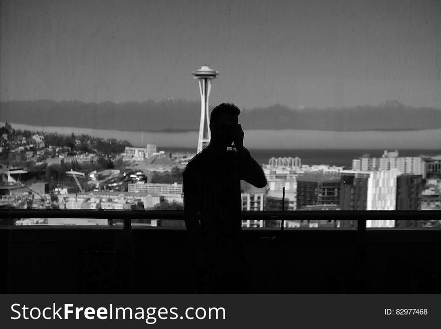 Silhouette of Man Near Handrails