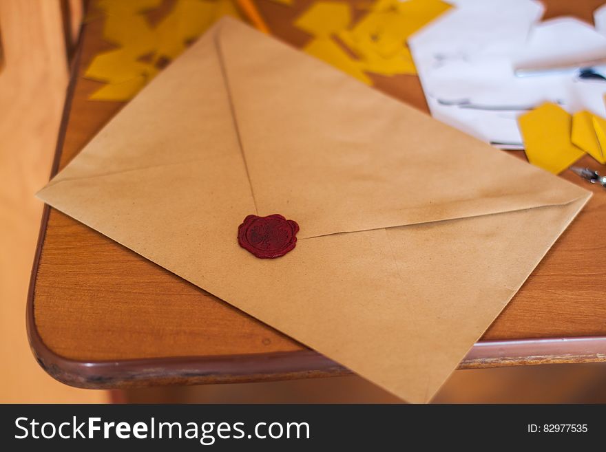 Brown Paper Envelope on Table