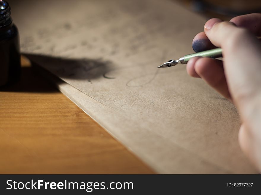 Person Holding Fountain Pen