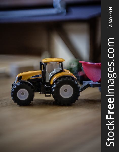 Orange And Black Front Loader Plastic Toy