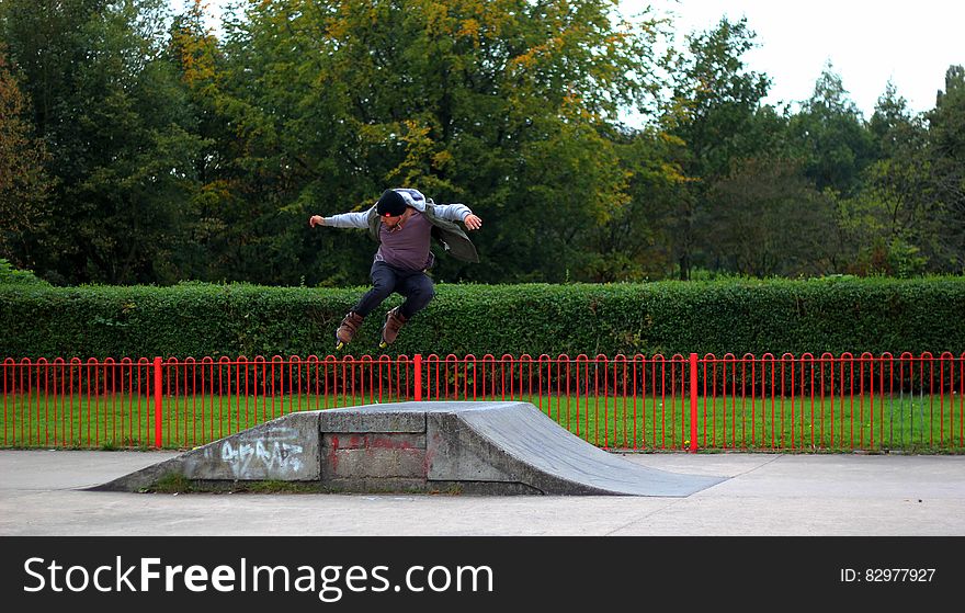 Man Jumping on Rollerskates Ramp