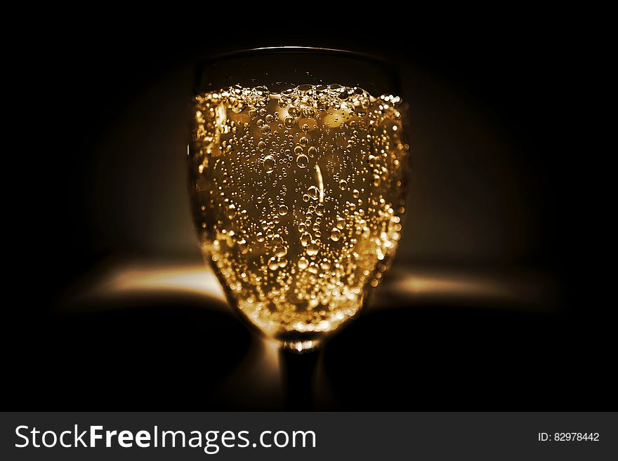 A close up shot of a glass of champagne.