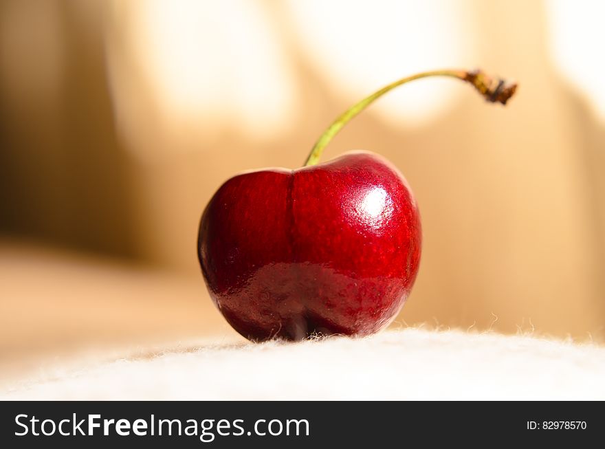 A close up of a red cherry. A close up of a red cherry.