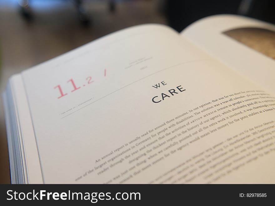 An open book with the text "we care".