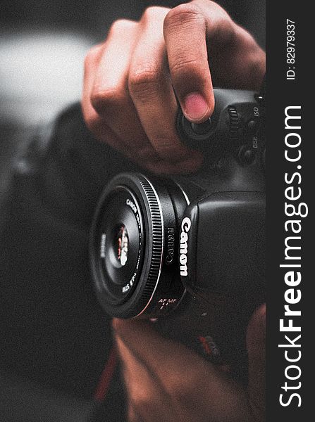 Person Holding Black Canon Dslr Camera Shallow Focus Photography