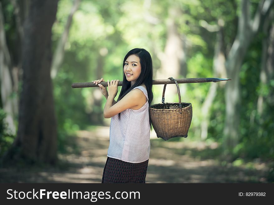 Portrait Of Smiling Woman In Forest