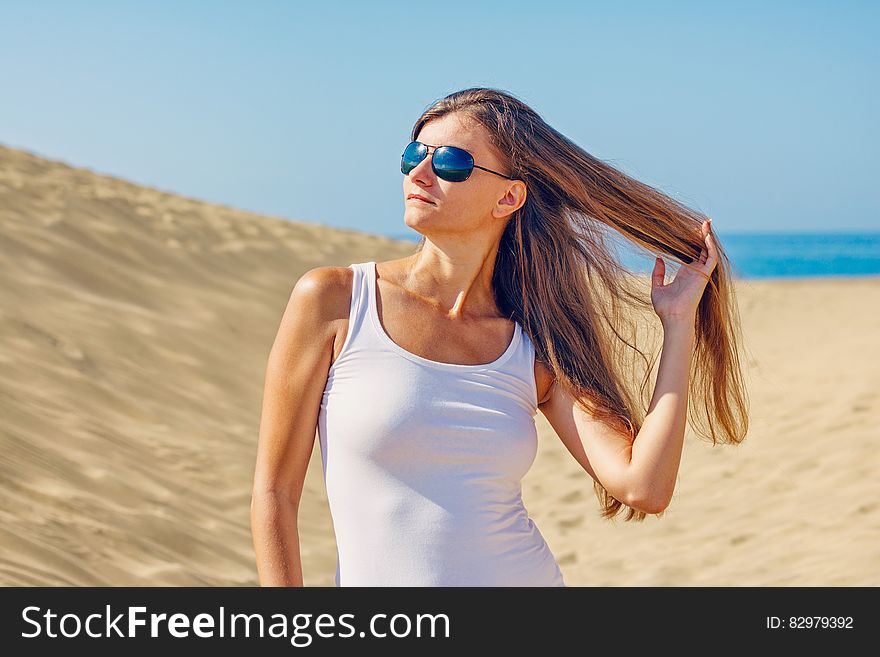 Woman Wearing Sunglasses at Beach