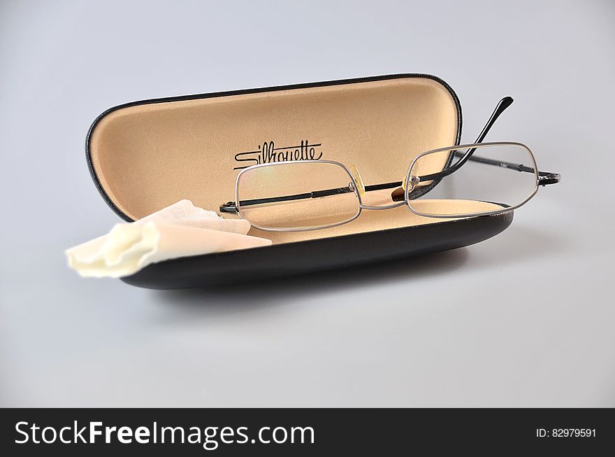 Silver Framed Eyeglasses on Black Eyewear Case