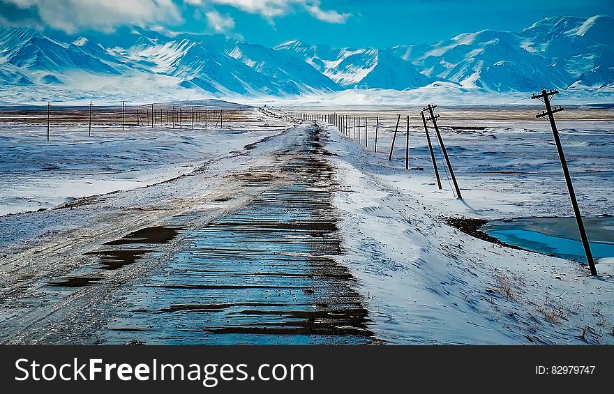 Scenic View of Snow Covered Mountains Against Sky