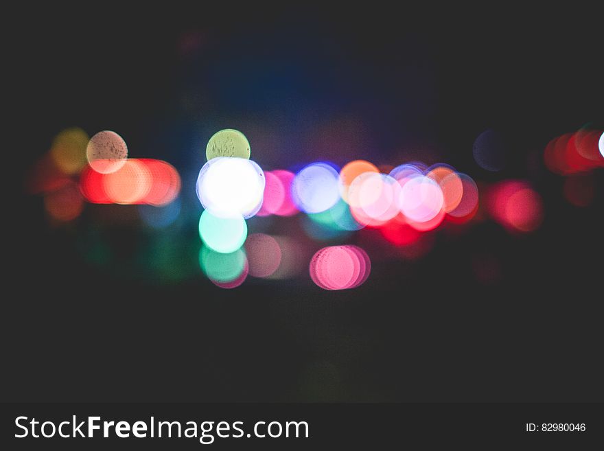 A background of blurred lights of different colors.