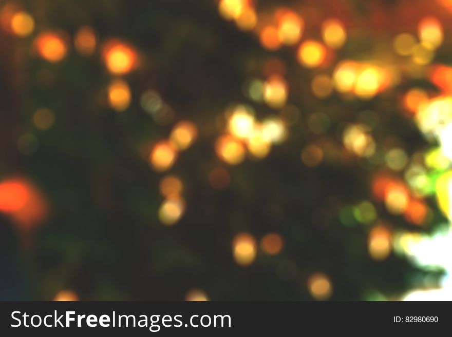 Bokeh blur of gold Christmas lights on black. Bokeh blur of gold Christmas lights on black.