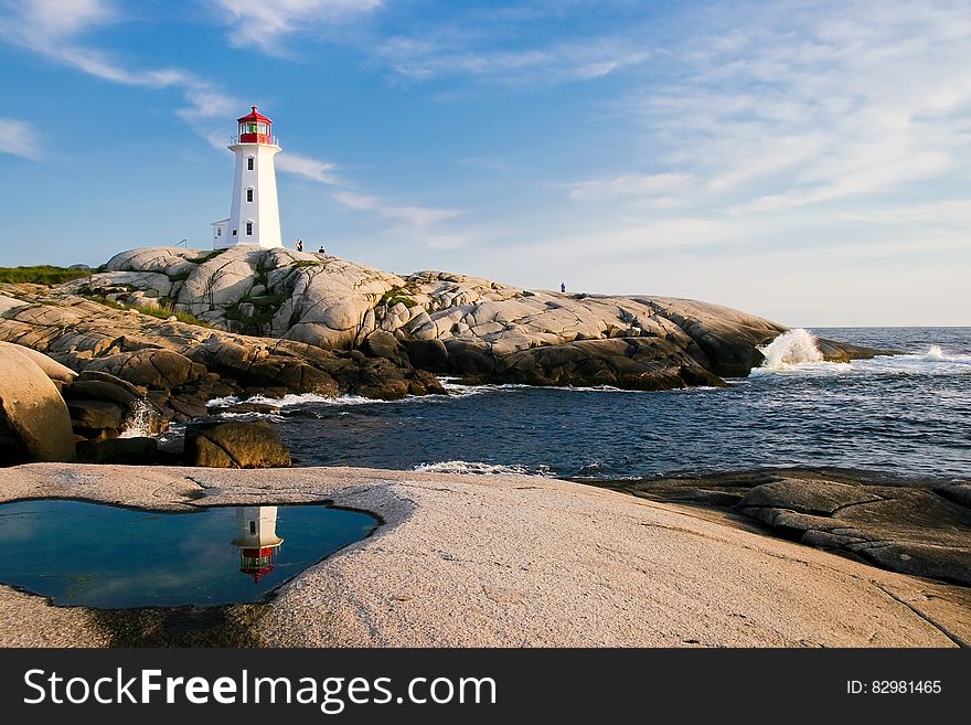 Lighthouse By Sea Against Sky