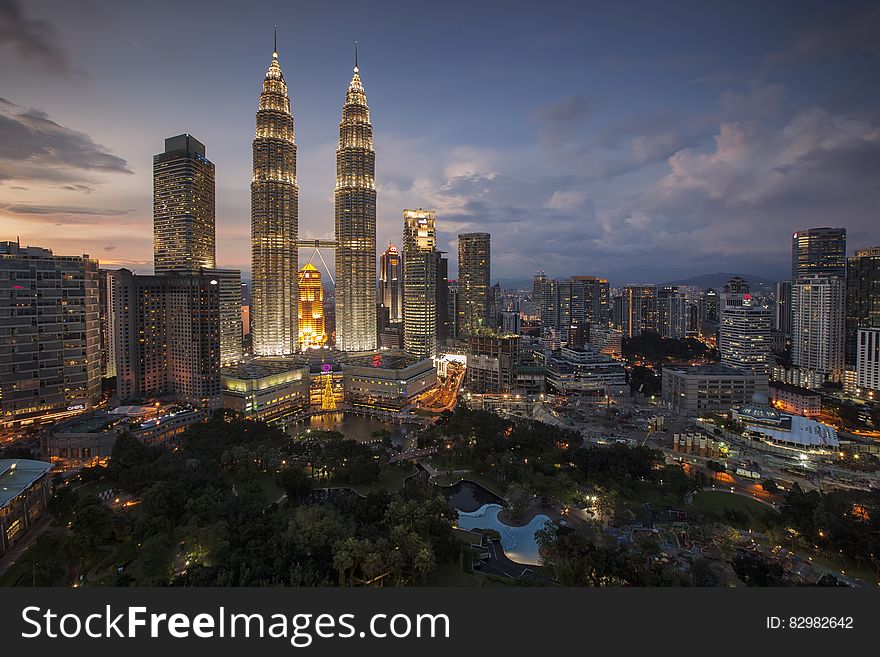Twin towers and skyline of Kuala Lumpur, Malaysia illuminated at night. Twin towers and skyline of Kuala Lumpur, Malaysia illuminated at night.