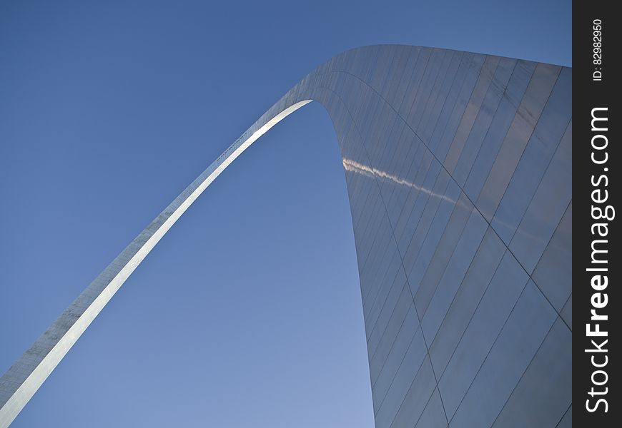 Facade of the St. Louis Arch in Missouri against blue skies on sunny day. Facade of the St. Louis Arch in Missouri against blue skies on sunny day.