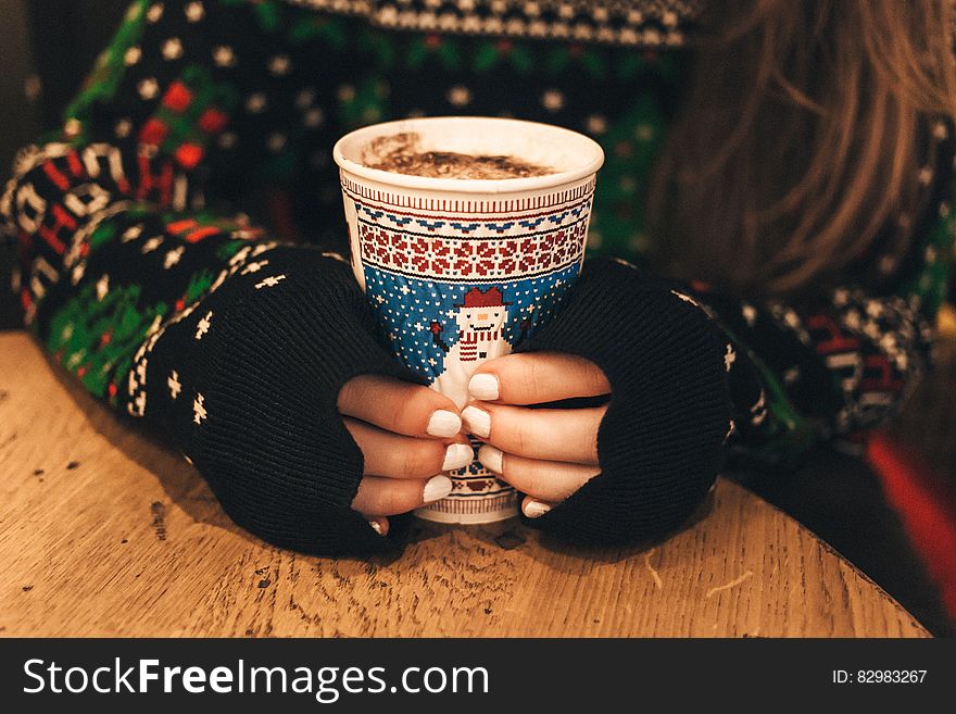 Close-up Of Hand Holding Cup