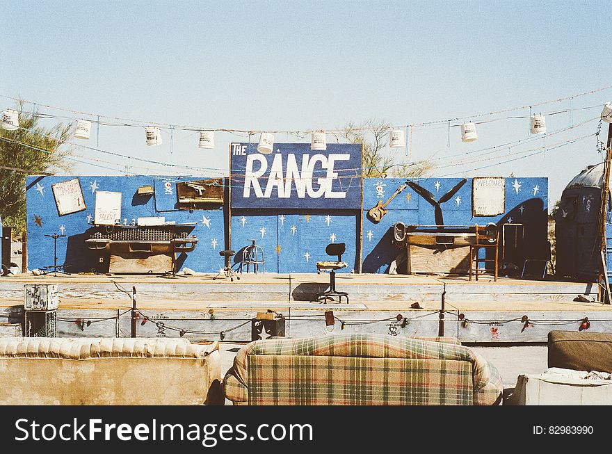 Western themed theater stage with old sofas on sunny day. Western themed theater stage with old sofas on sunny day.