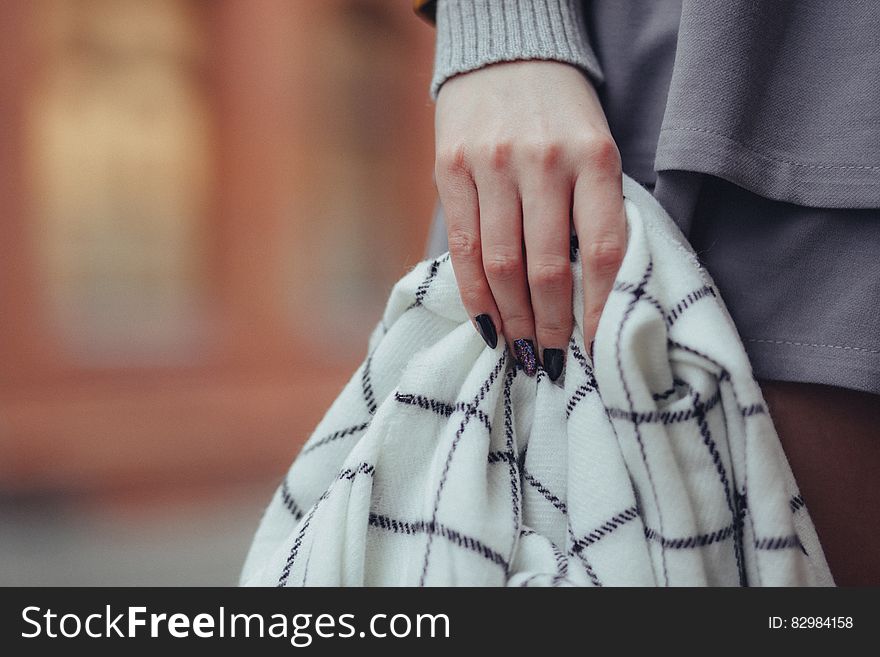 Woman Holding Sweater