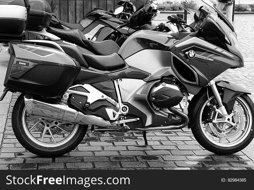 Motorbikes parked on street in black and white. Motorbikes parked on street in black and white.