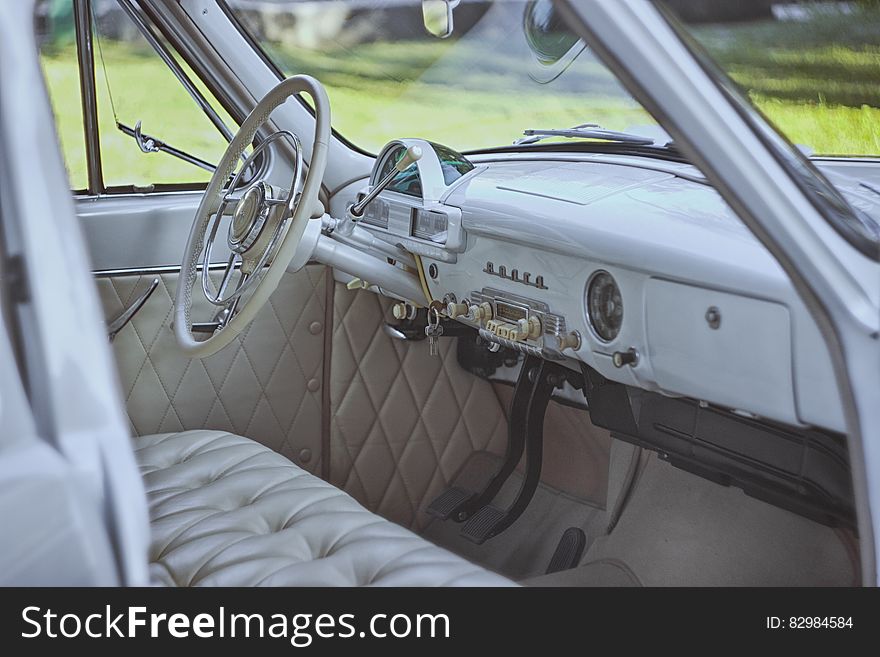 Interior of vintage automobile in grey leather. Interior of vintage automobile in grey leather.