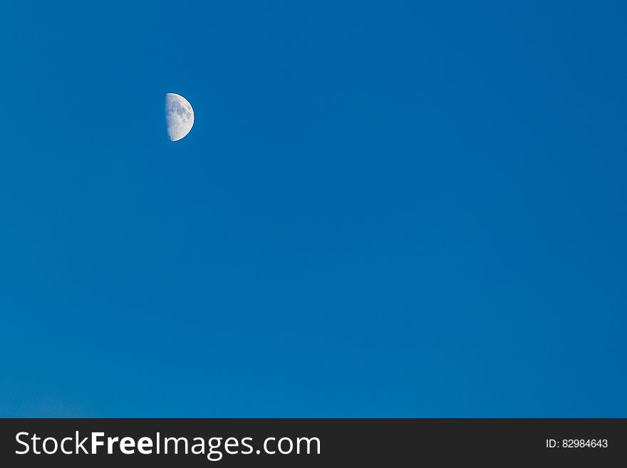 A half moon on the blue sky. A half moon on the blue sky.