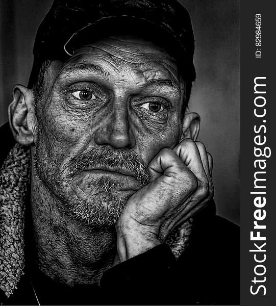 Man In Black Cap Grayscale Photo